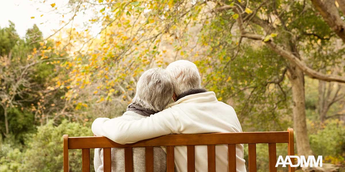 older couple on bench outdoors
